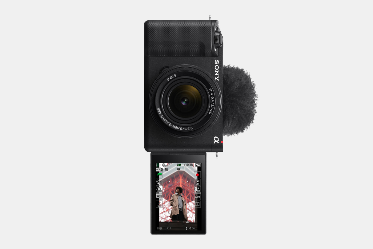 Image of ZV-E1 camera with LCD display flipped to front with image of a man shown in Vertical information display