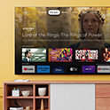 Living room with a wall-mounted BRAVIA TV displaying an array of entertainment apps and streaming services