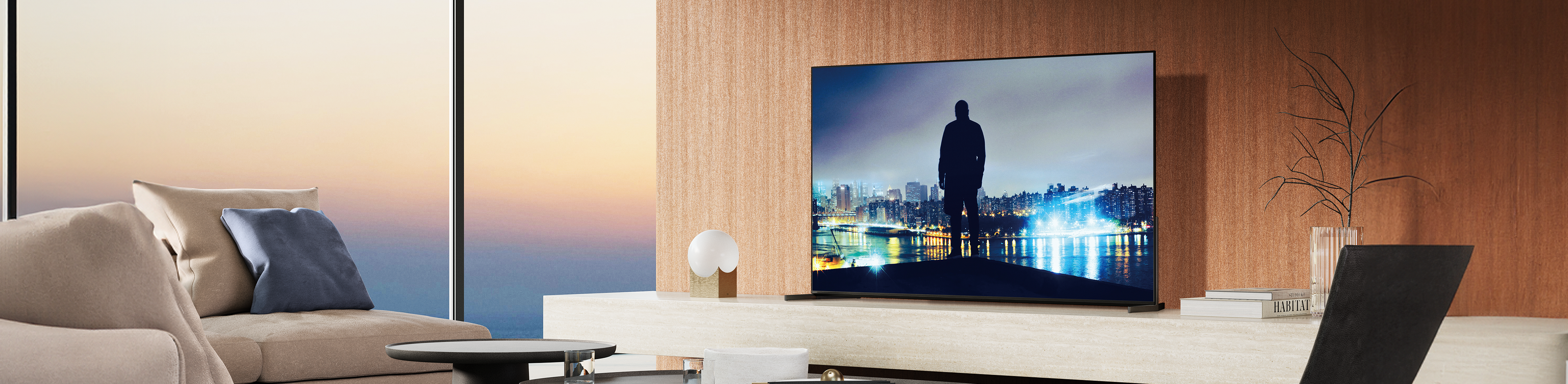 Living room setup with BRAVIA 8 II displaying night skyline.