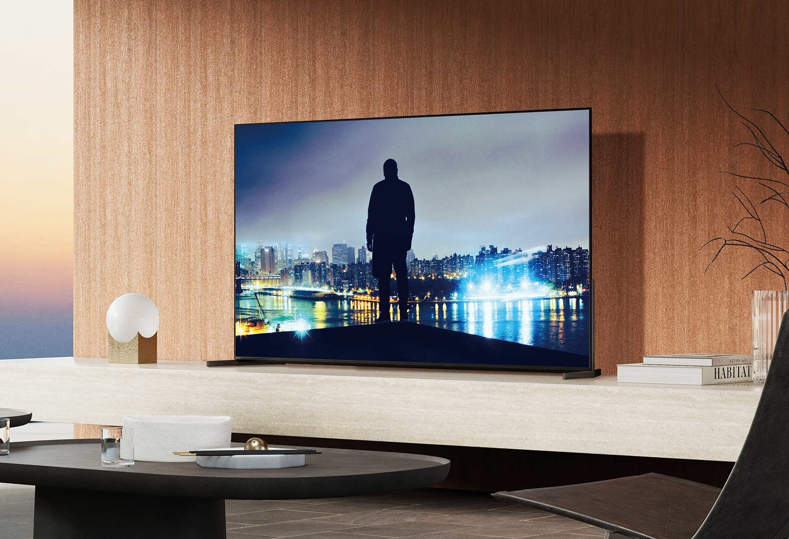 Living room setup with BRAVIA 8 II displaying night skyline.